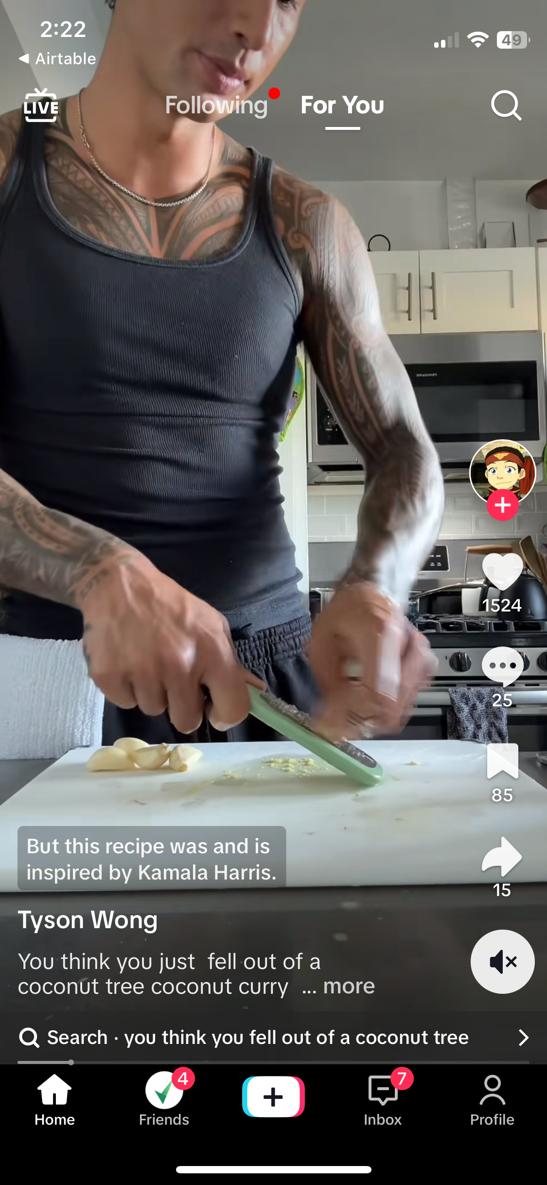 A screenshot of TikTok. A man is cooking. The caption reads "You think you just fell out of a coconut tree coconut curry..."