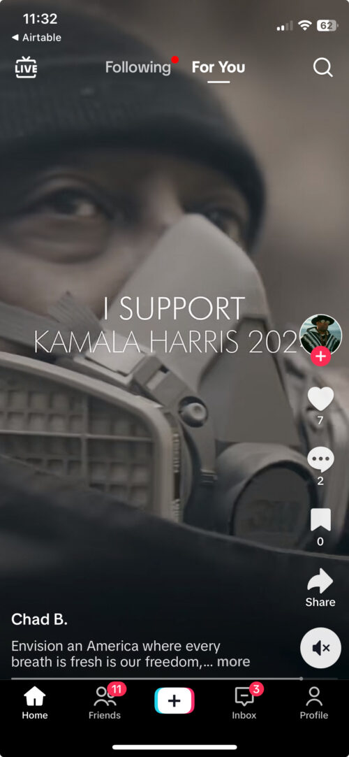 A screenshot of a TikTok. A man in a gas mask behind the words "I support Kamala Harris 2024"